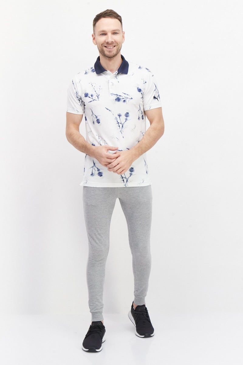 PUMA قمصان بولو رياضية للرجال بنقشة زهور، باللون الأبيض/الأزرق الداكن - Image 4